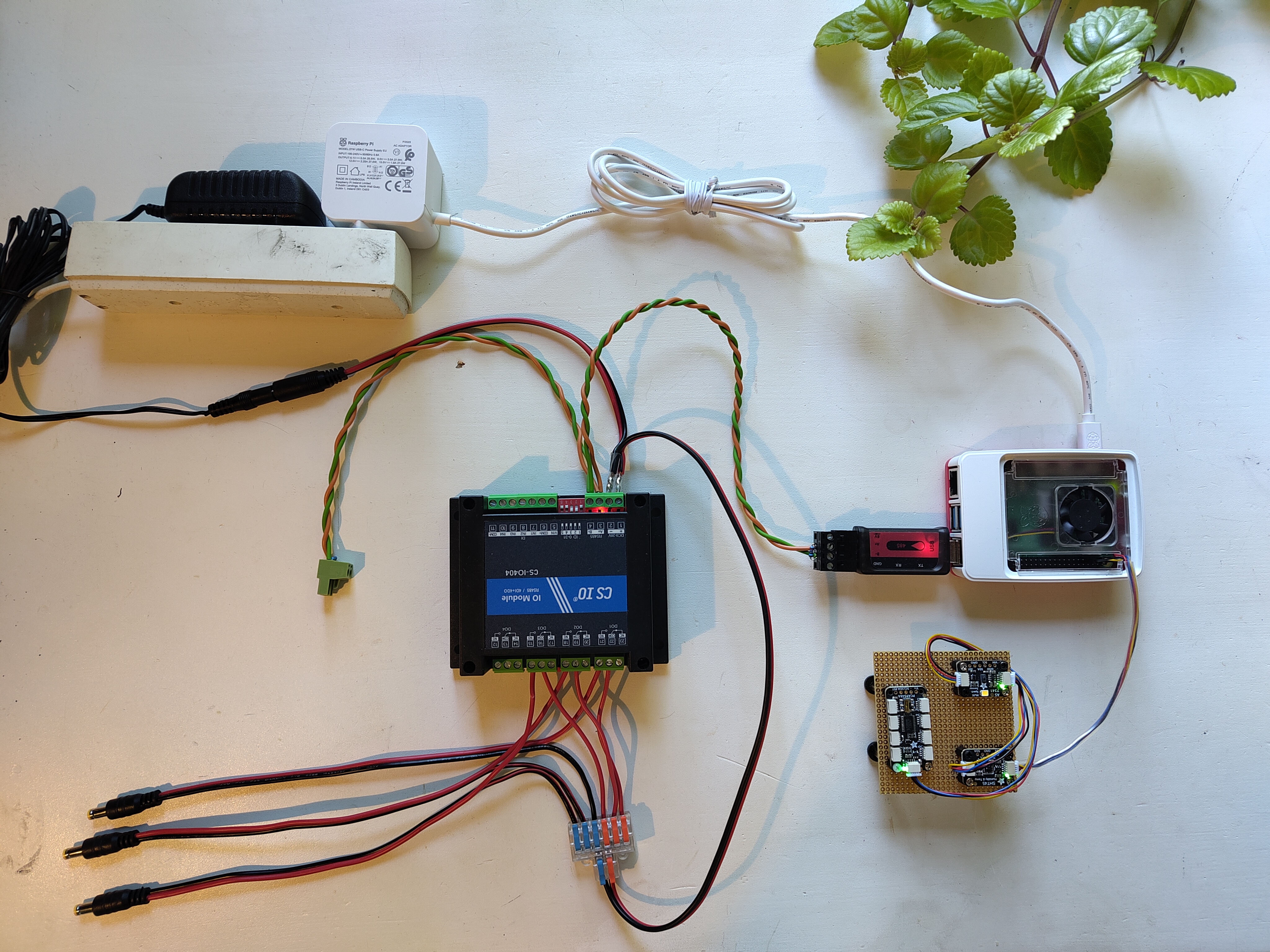 The assembled core of the controller: the Raspberry Pi 5, the USB to RS485 dongle, the CS-IO404 relay module, and the SHT45 and AS7341 sensor modules.
